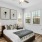Furnished bedroom with a large window and ceiling fan inside homes at Legacy on Rockhill