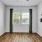 Unfurnished bedroom with a large window inside a home at Legacy on Rockhill