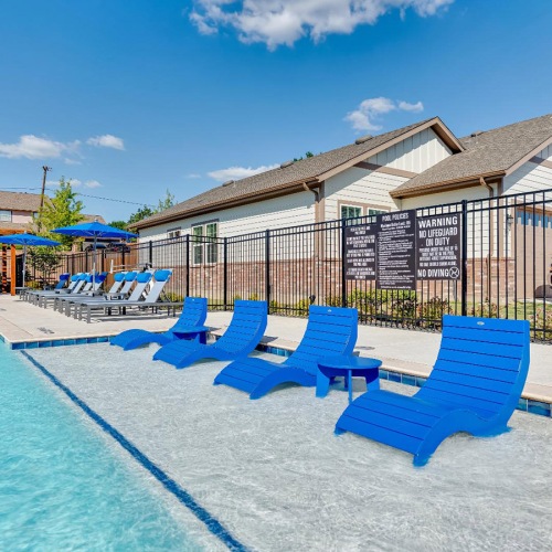 Relax and unwind poolside in shelf seating at Legacy on Rockhill
